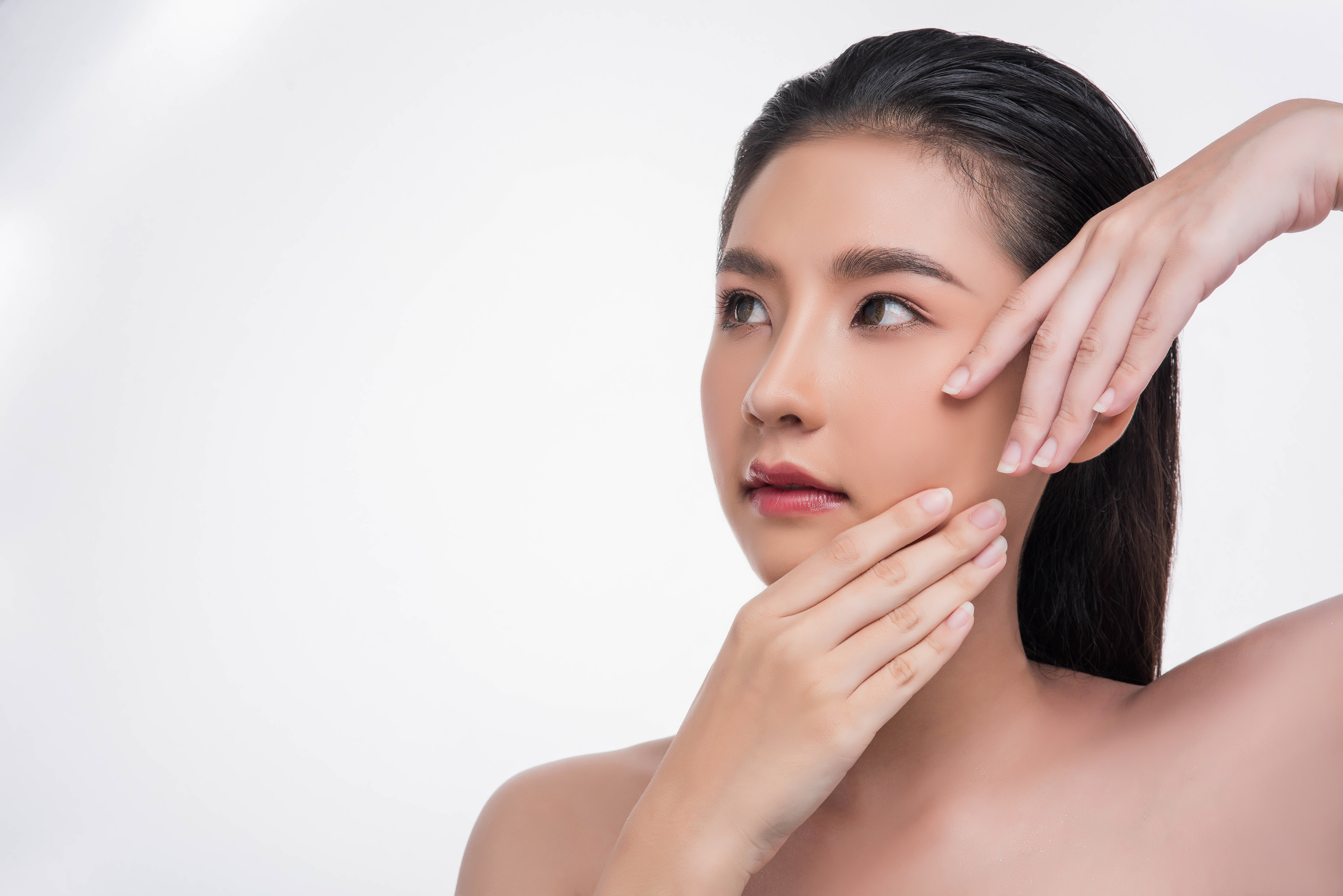 A woman showing her clear skin